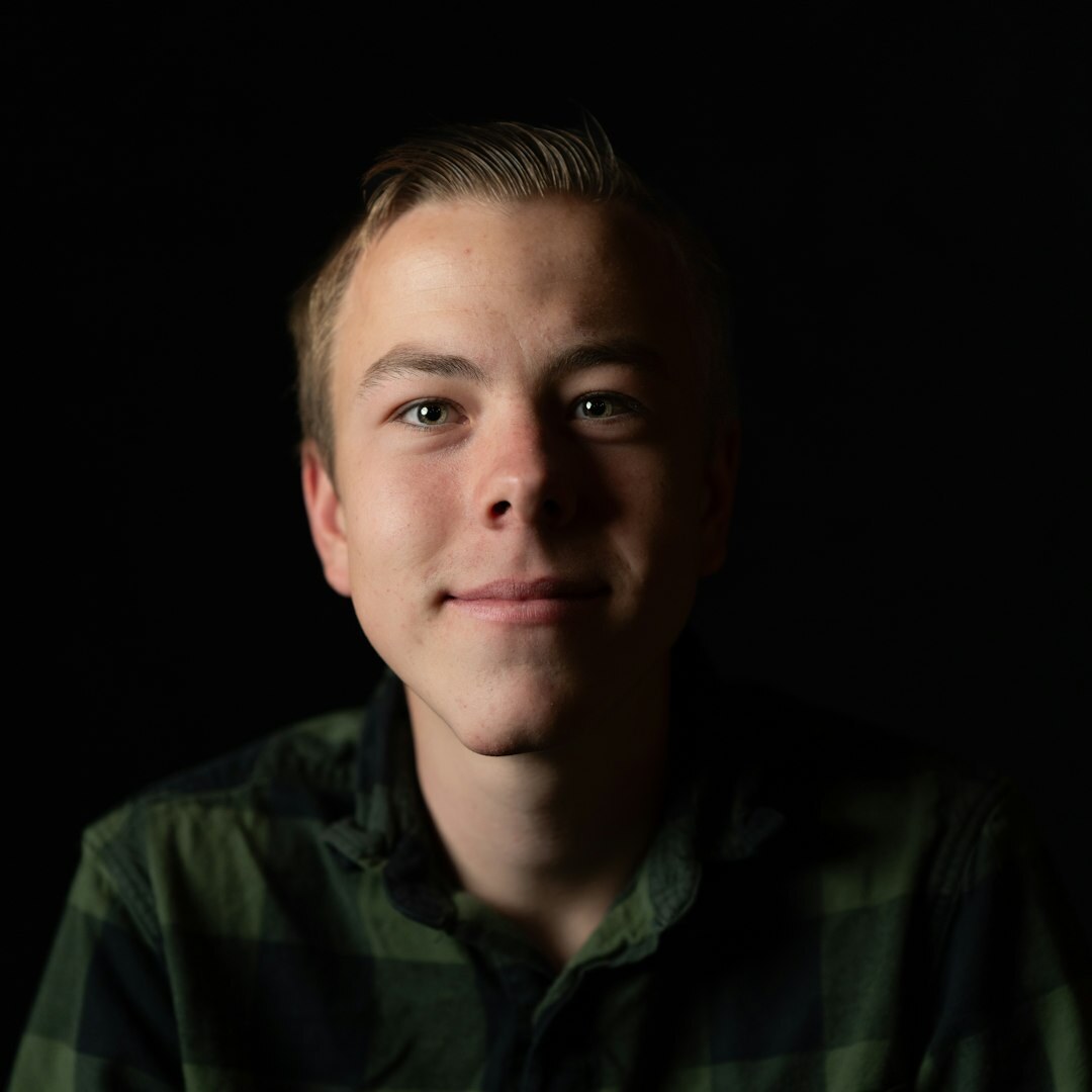 Studio portrait of a man in his 30s smiling